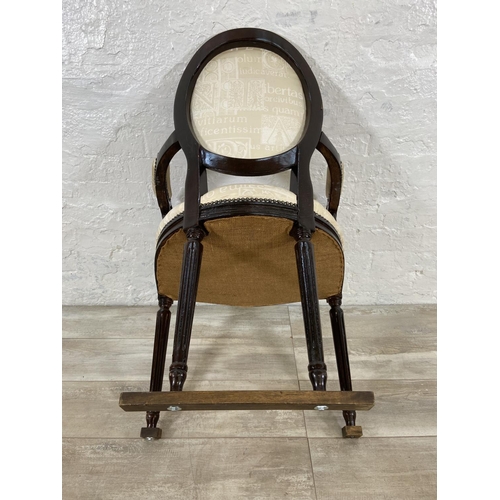 145 - A French Louis XVI style stained hardwood and fabric upholstered open armchair