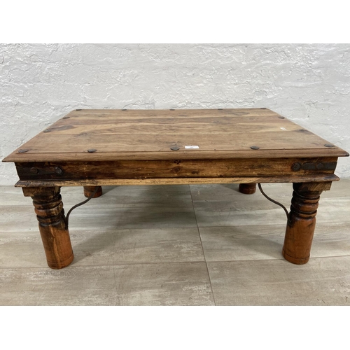 146 - An Indian sheesham wood coffee table - approx. 40cm high x 60cm wide x 90cm long