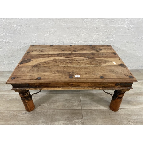 146 - An Indian sheesham wood coffee table - approx. 40cm high x 60cm wide x 90cm long