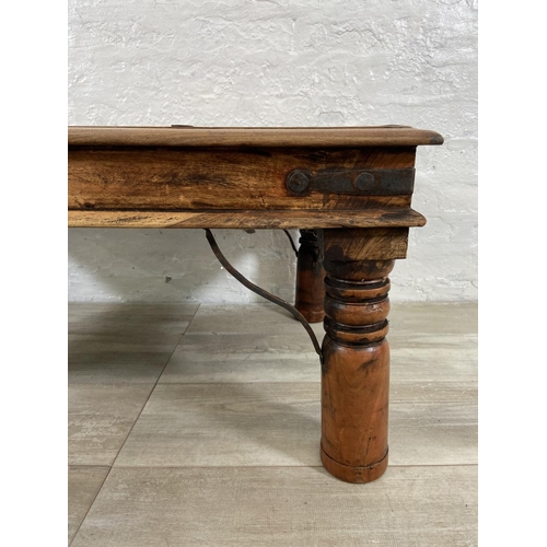 146 - An Indian sheesham wood coffee table - approx. 40cm high x 60cm wide x 90cm long