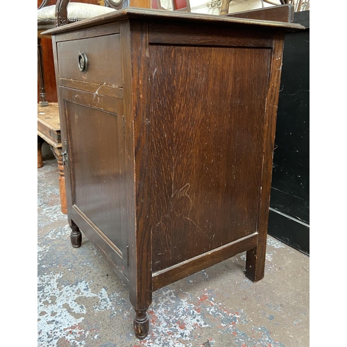 148 - An early 20th century oak bedside cabinet - approx. 80cm high x 60cm wide x 50cm deep