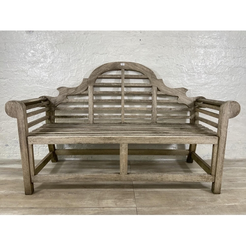 155 - A Lutyens style teak garden bench - approx. 104cm high x 163cm wide x 57cm deep