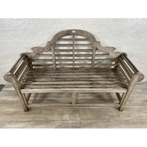 155 - A Lutyens style teak garden bench - approx. 104cm high x 163cm wide x 57cm deep