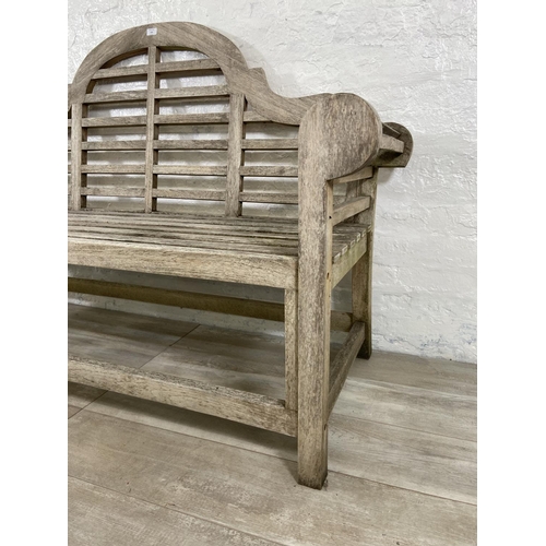 155 - A Lutyens style teak garden bench - approx. 104cm high x 163cm wide x 57cm deep