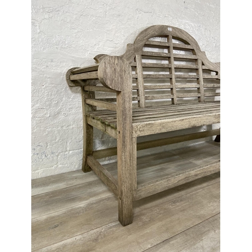 155 - A Lutyens style teak garden bench - approx. 104cm high x 163cm wide x 57cm deep