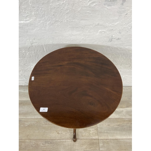 156 - A Georgian mahogany circular tilt top tripod occasional table - approx. 102cm high when tilted x 55c... 