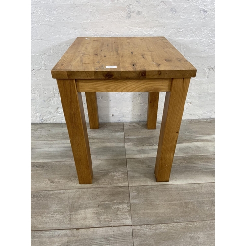 165 - A modern oak side table - approx. 62cm high x 55cm wide x 50cm deep