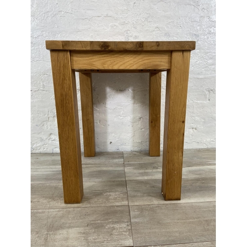 165 - A modern oak side table - approx. 62cm high x 55cm wide x 50cm deep