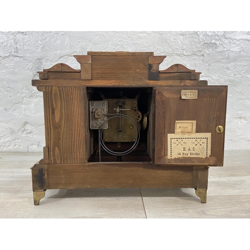 173 - A Victorian walnut cased 14 day strike mantel clock with gilt metal supports, pendulum and key - app... 