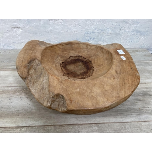 174 - A teak fruit bowl - approx. 54cm x 47cm