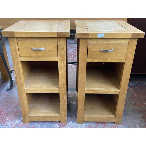 175 - A pair of modern oak side tables - approx. 76cm high x 40cm wide x 40cm deep