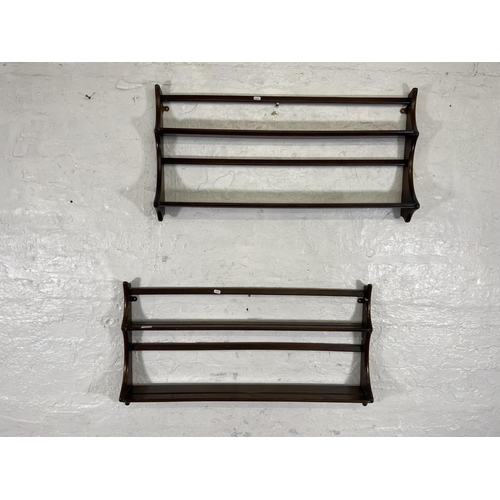 177 - Two Ercol Old Colonial elm wall hanging two tier plate racks