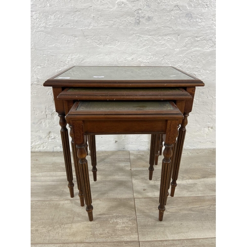 180 - A mahogany and green leather nest of tables - approx. 52cm high x 53cm wide x 39cm deep