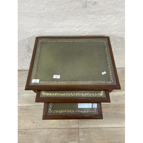 180 - A mahogany and green leather nest of tables - approx. 52cm high x 53cm wide x 39cm deep