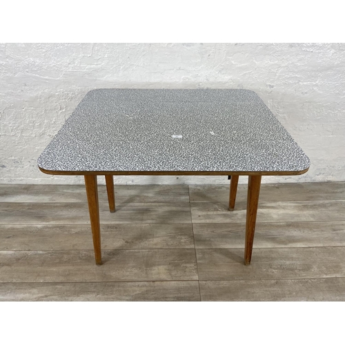 181 - A mid 20th century melamine and beech drop leaf dining table - approx. 75cm high x 91cm wide x 80cm ... 