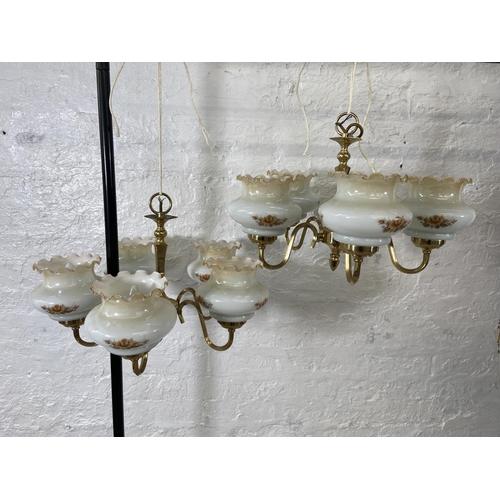 186 - A pair of brass five branch chandeliers with floral design opaque glass shades