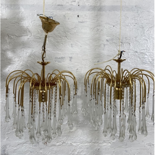 187 - A pair of Murano brass and glass teardrop chandeliers