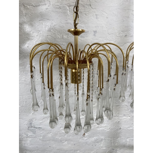 187 - A pair of Murano brass and glass teardrop chandeliers