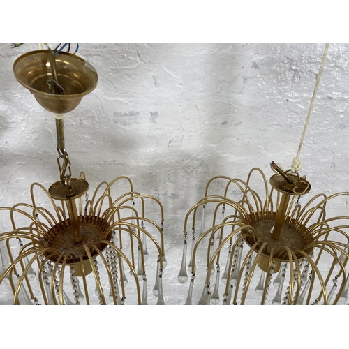 187 - A pair of Murano brass and glass teardrop chandeliers