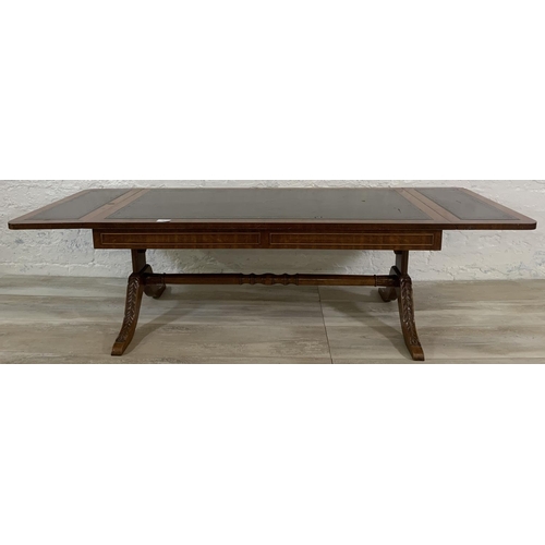 193 - A 19th century style mahogany and green leather drop leaf coffee table