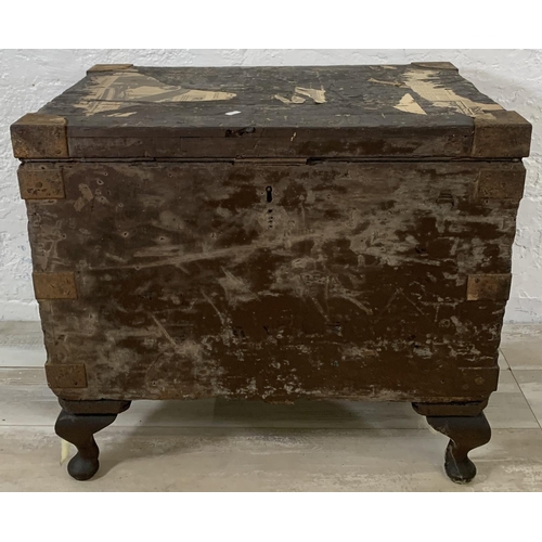 195 - Two early 20th century items, one metal travel trunk and one ebonised pine toolbox