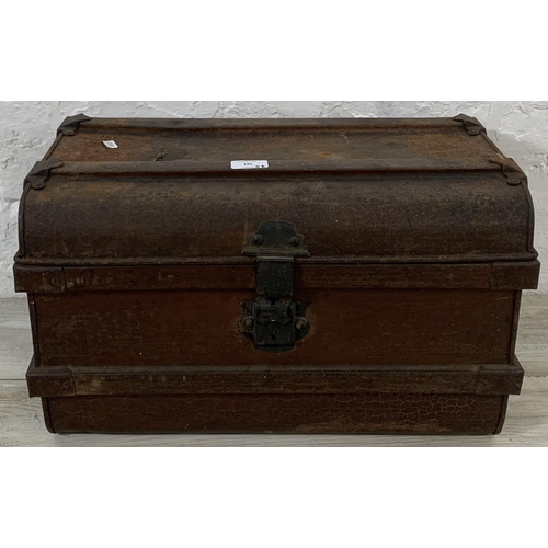 195 - Two early 20th century items, one metal travel trunk and one ebonised pine toolbox