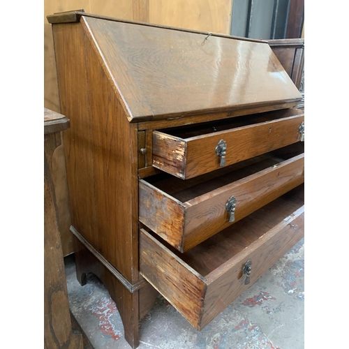 199 - A 1930s oak bureau - approx. 96cm high x 90cm wide x 42cm deep