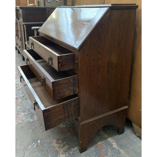 199 - A 1930s oak bureau - approx. 96cm high x 90cm wide x 42cm deep