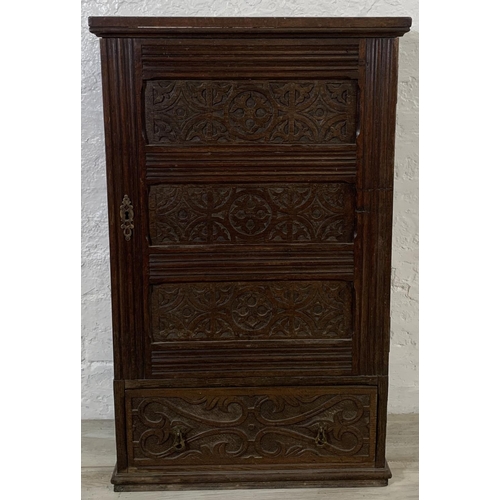 200 - A 19th century carved oak wall mountable cabinet - approx. 97cm high x 60cm wide x 24cm deep