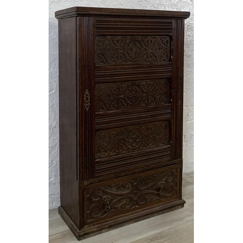 200 - A 19th century carved oak wall mountable cabinet - approx. 97cm high x 60cm wide x 24cm deep