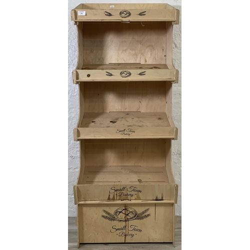 203 - A plywood four tier baker's shop display stand - approx. 137cm high x 55cm wide x 38cm deep