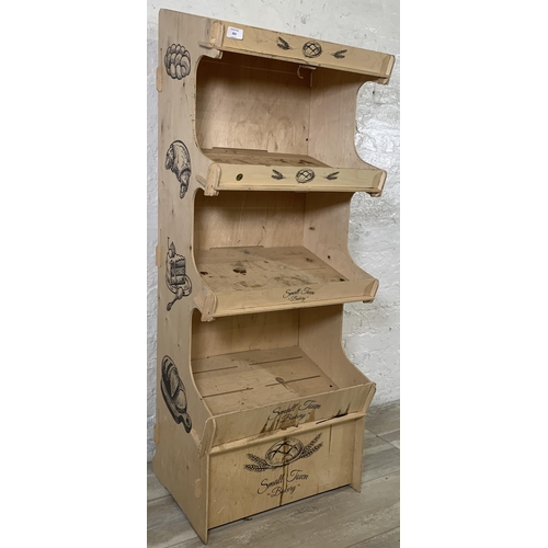 203 - A plywood four tier baker's shop display stand - approx. 137cm high x 55cm wide x 38cm deep