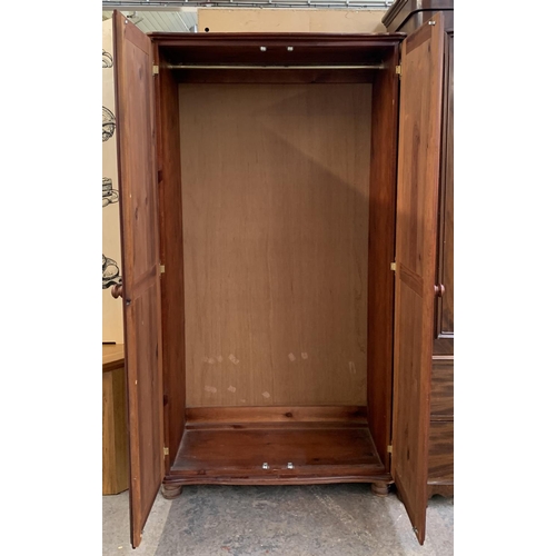 205 - A modern stained pine double wardrobe - approx. 180cm high x 95cm wide x 50cm deep