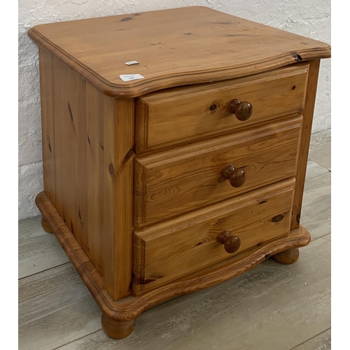 220 - A pine bedside chest of drawers - approx. 52cm high x 52cm wide x 45cm deep