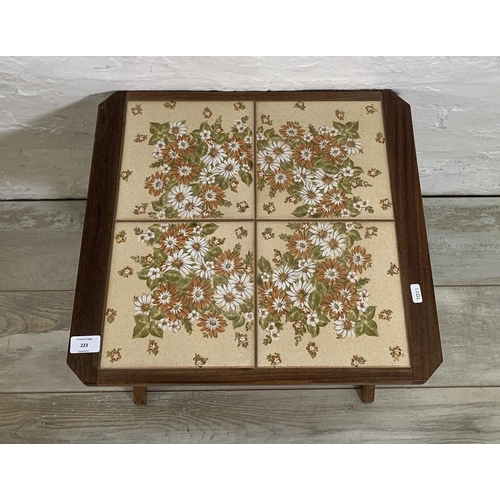 223 - A mid 20th century teak and ceramic tile top side table - approx. 45cm high x 49cm wide x 44cm deep