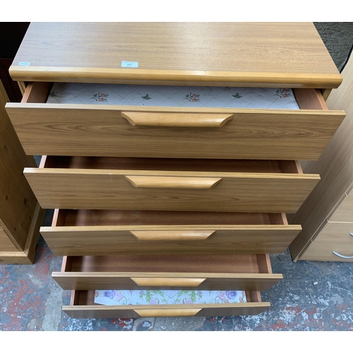 224 - A teak effect chest of drawers - approx. 105cm high x 77cm wide x 42cm deep