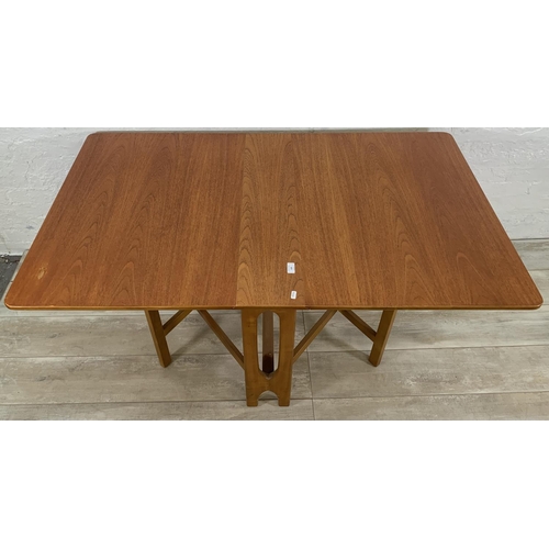 229 - A mid 20th century teak drop leaf gate leg dining table - approx. 74cm high x 83cm wide x 144cm long