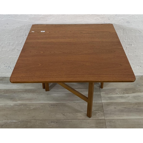 229 - A mid 20th century teak drop leaf gate leg dining table - approx. 74cm high x 83cm wide x 144cm long