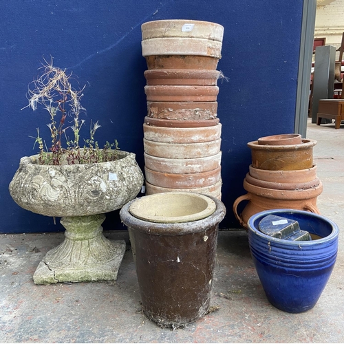 231 - A collection of garden planters to include terracotta, cast stone, blue glazed etc.