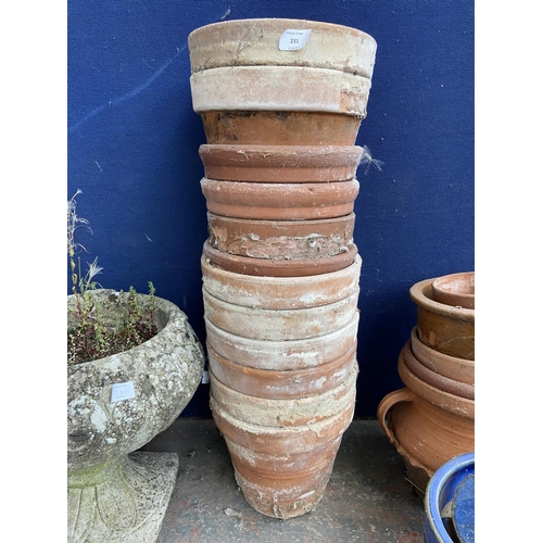 231 - A collection of garden planters to include terracotta, cast stone, blue glazed etc.