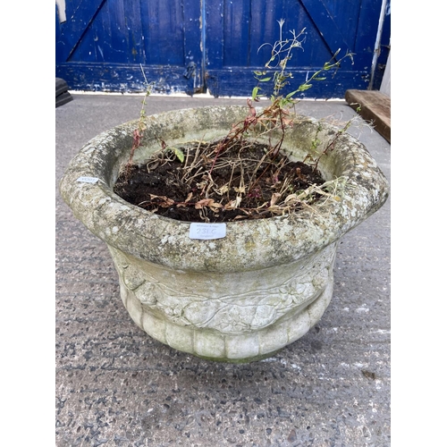 231C - A cast stone circular garden planter with rams head design - approx. 40cm high x 40cm diameter