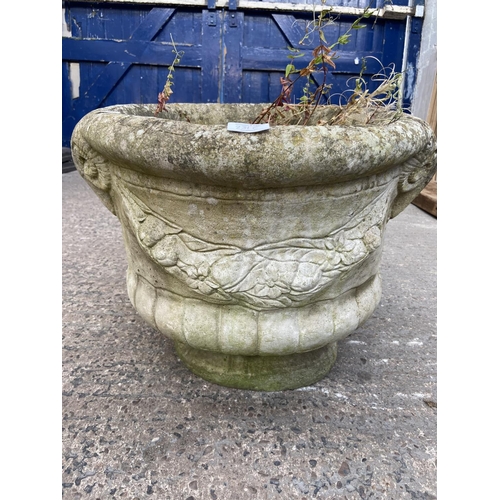 231C - A cast stone circular garden planter with rams head design - approx. 40cm high x 40cm diameter