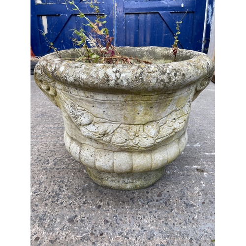 231C - A cast stone circular garden planter with rams head design - approx. 40cm high x 40cm diameter