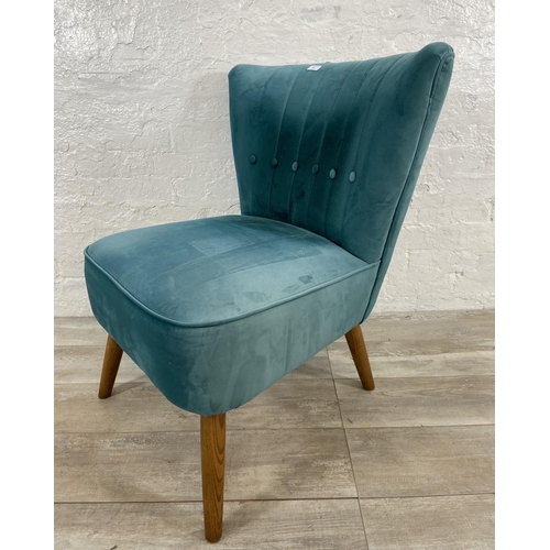 239 - A Dunelm green fabric upholstered occasional chair on oak supports