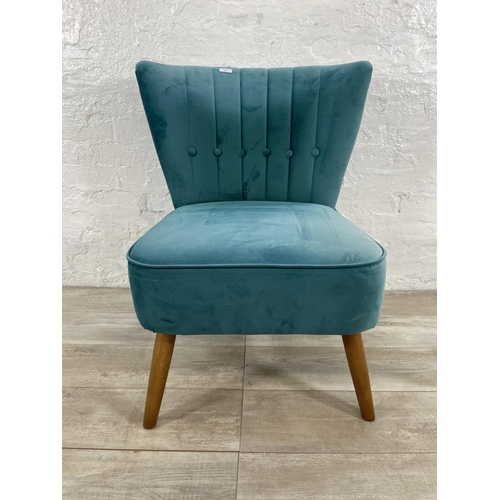 239 - A Dunelm green fabric upholstered occasional chair on oak supports