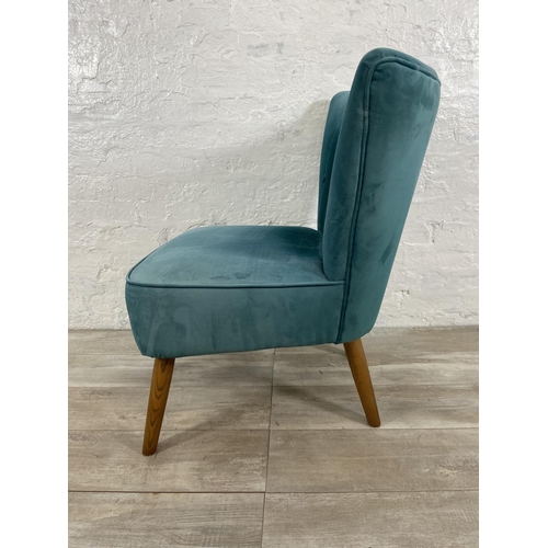 239 - A Dunelm green fabric upholstered occasional chair on oak supports