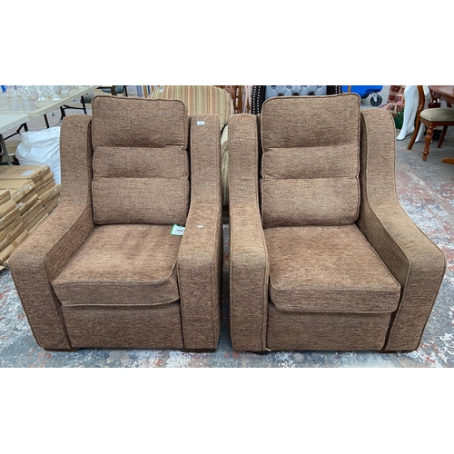 242 - A pair of modern brown fabric upholstered armchairs