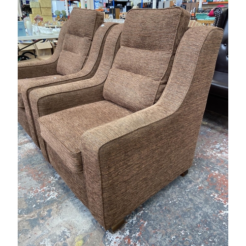 242 - A pair of modern brown fabric upholstered armchairs