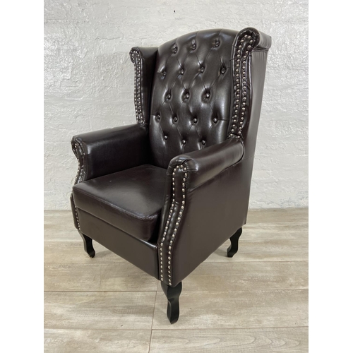 243 - A brown faux leather Chesterfield wingback armchair