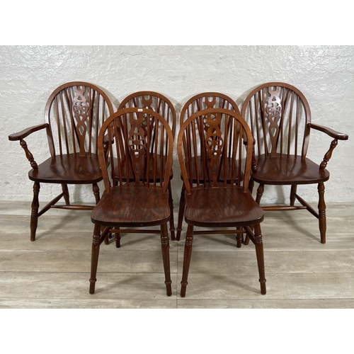 245 - Six elm and beech wheelback dining chairs